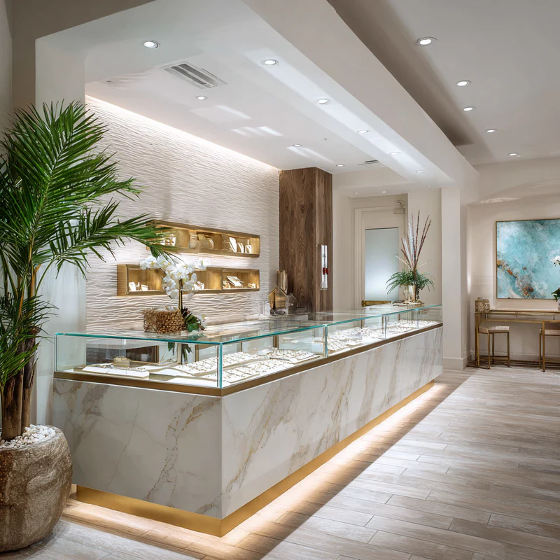 Hands measuring a quartz slab with tape measure