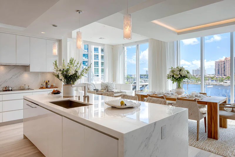 High-rise kitchen with marina view and white quartz