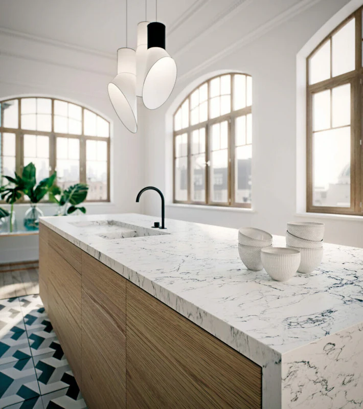 Loft kitchen with thick Carrara quartz and arched details